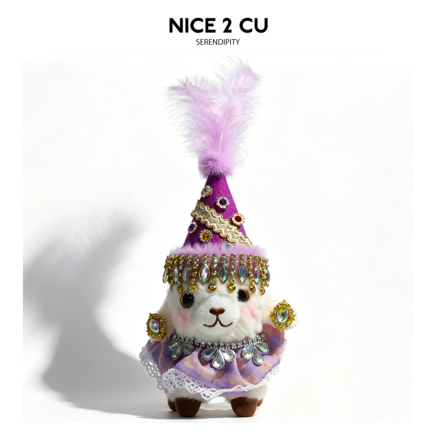 White plush lamb wearing a purple cone hat with pink feather plume, beaded fringe band, and purple lace-check skirt