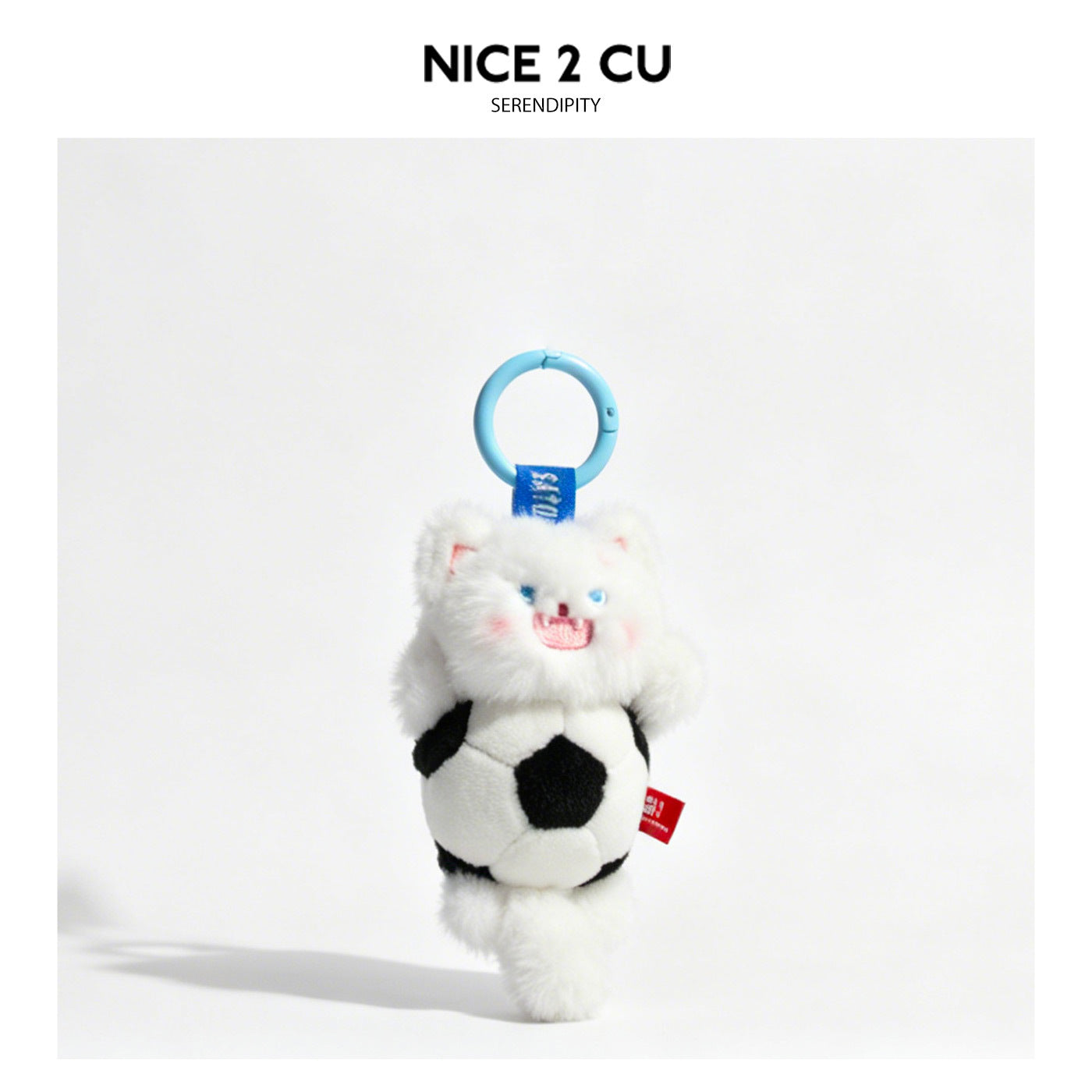White standing plush cat keychain with soccer ball and light blue carabiner clip