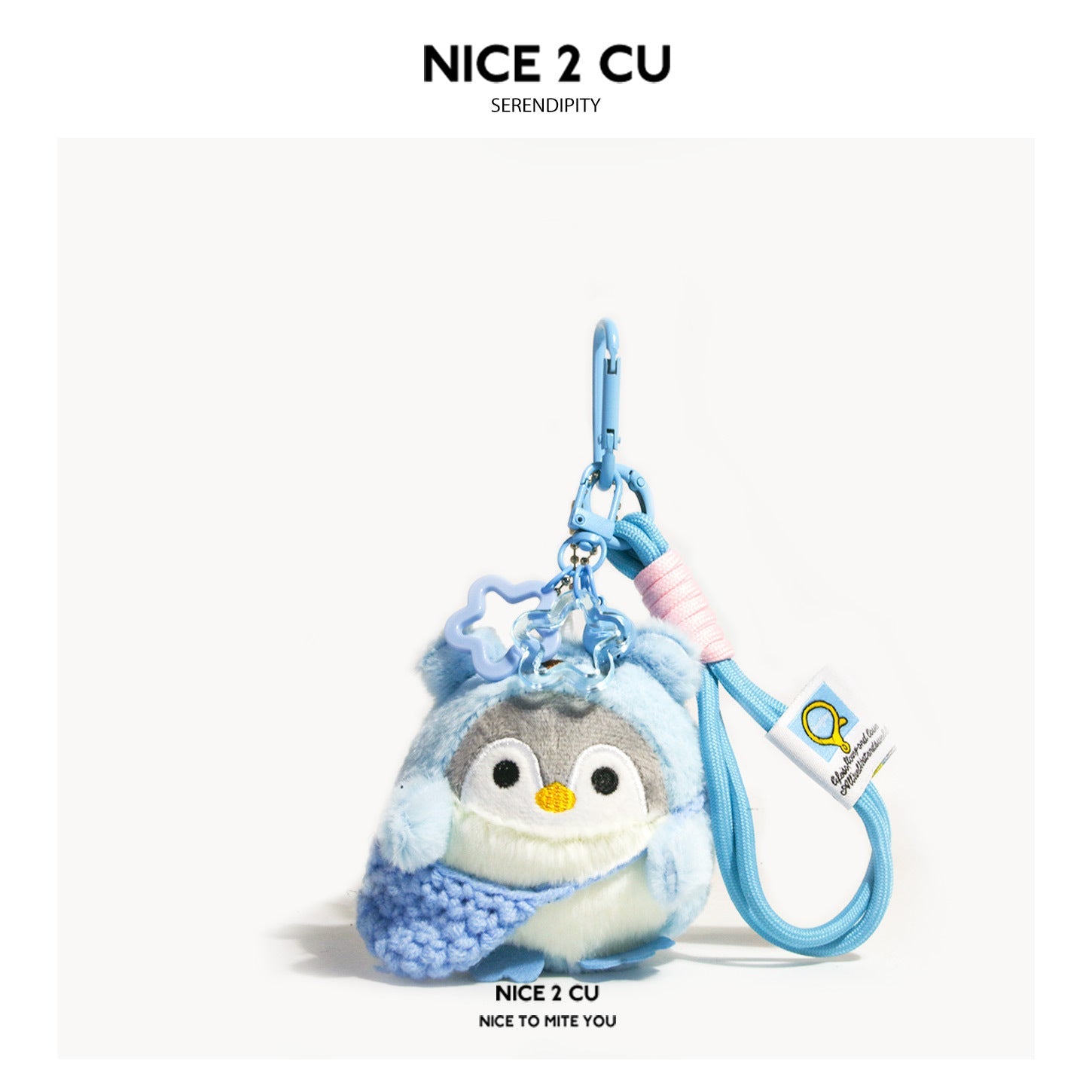 Blue kawaii penguin plush bag charm with knitted wrap, translucent star charm, and blue carabiner clip