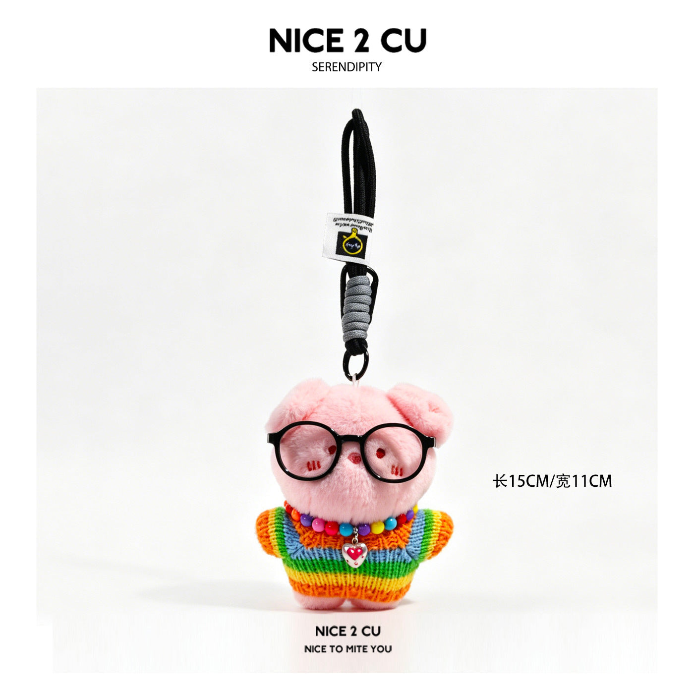 Pink pig plush bag charm wearing a rainbow-striped sweater, round black glasses, and a multicolor bead necklace with heart pe