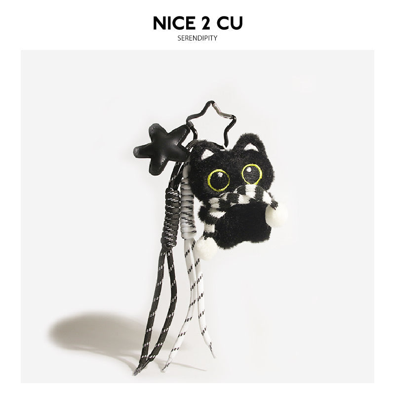 Black cat plush keychain with black-and-white patterned scarf, star charm, and hanging braided cord tassels