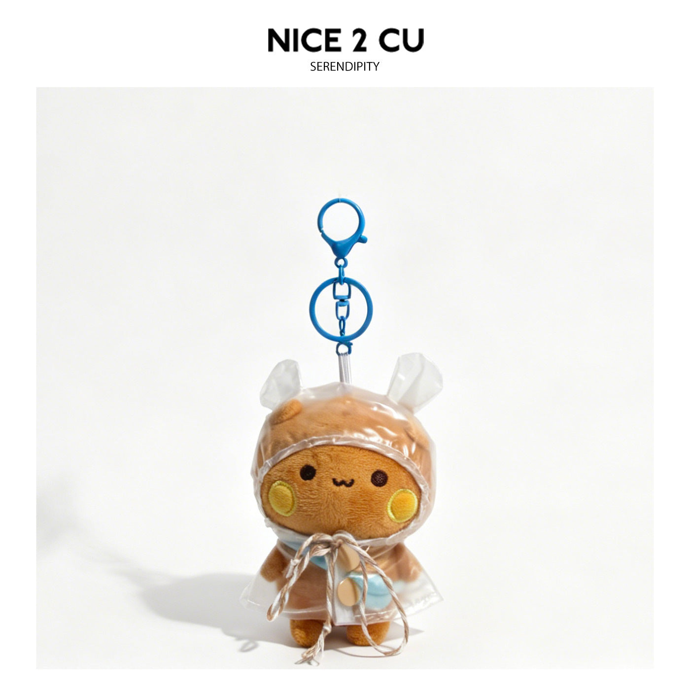 Brown kawaii plush animal keychain charm in a transparent hooded raincoat with blue clip hardware