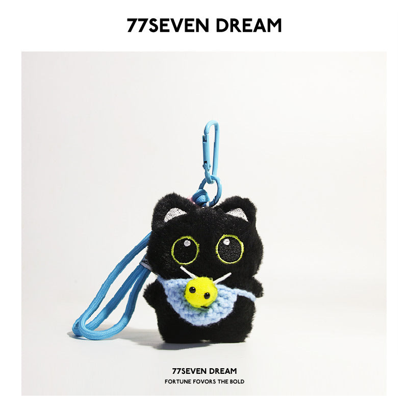 Black cat plush charm with light blue crocheted bee-front panel and small yellow bee motif, blue carabiner