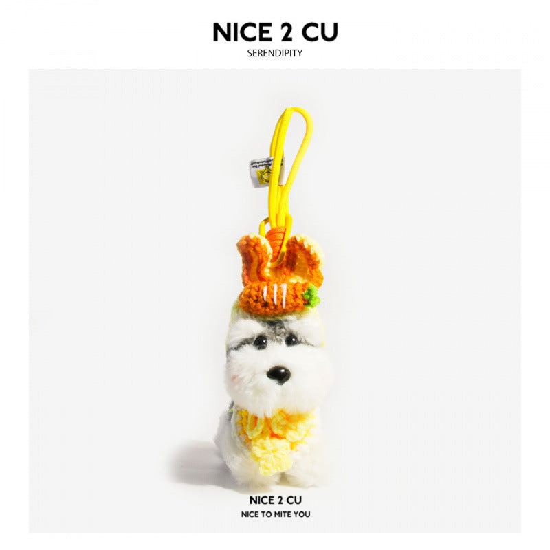Schnauzer plush bag charm wearing an orange crocheted carrot hat and yellow ruffled collar with loop cord attachment