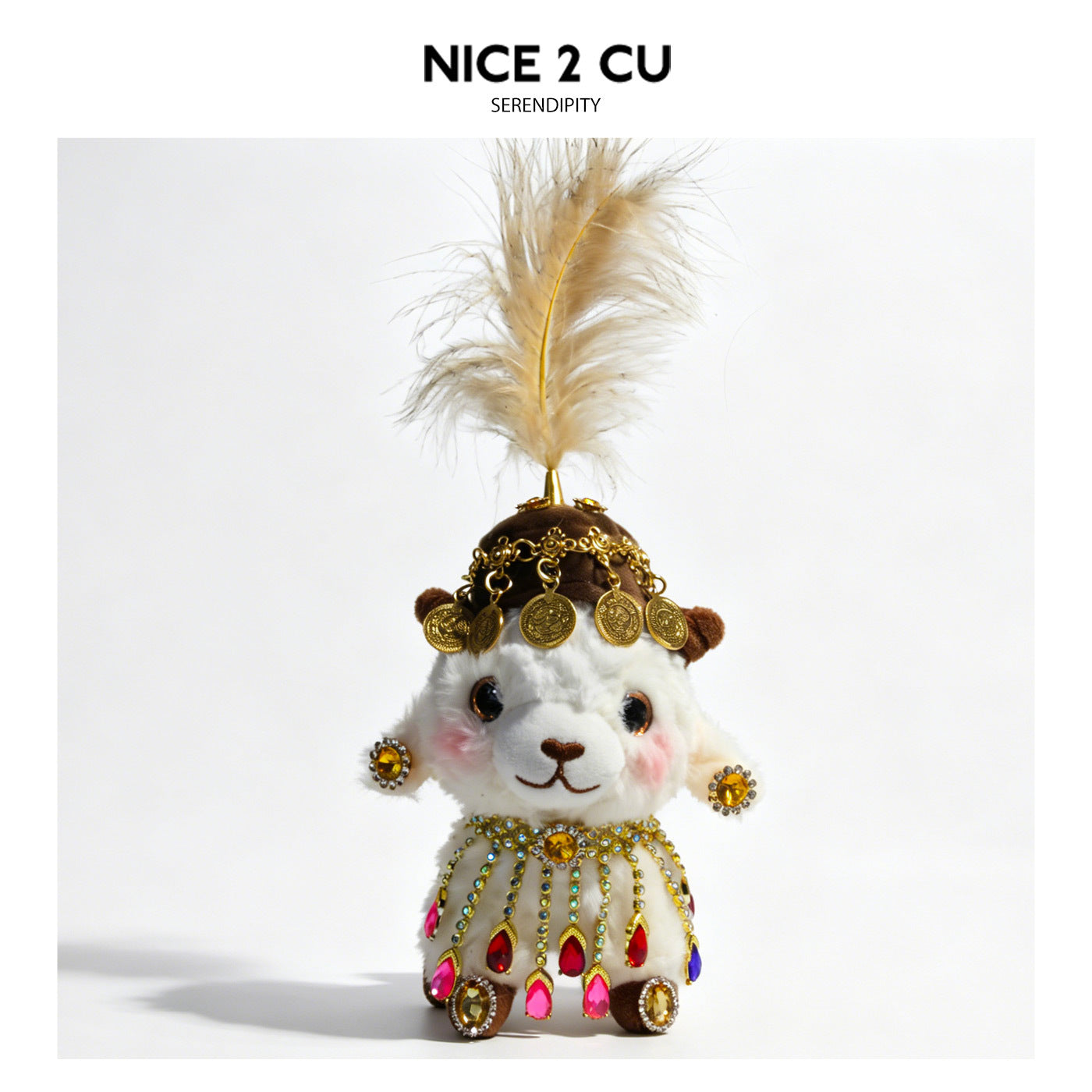 White plush lamb with brown-and-gold coin-adorned hat, cream feather topper, and gold fringe body decoration with multicolor 