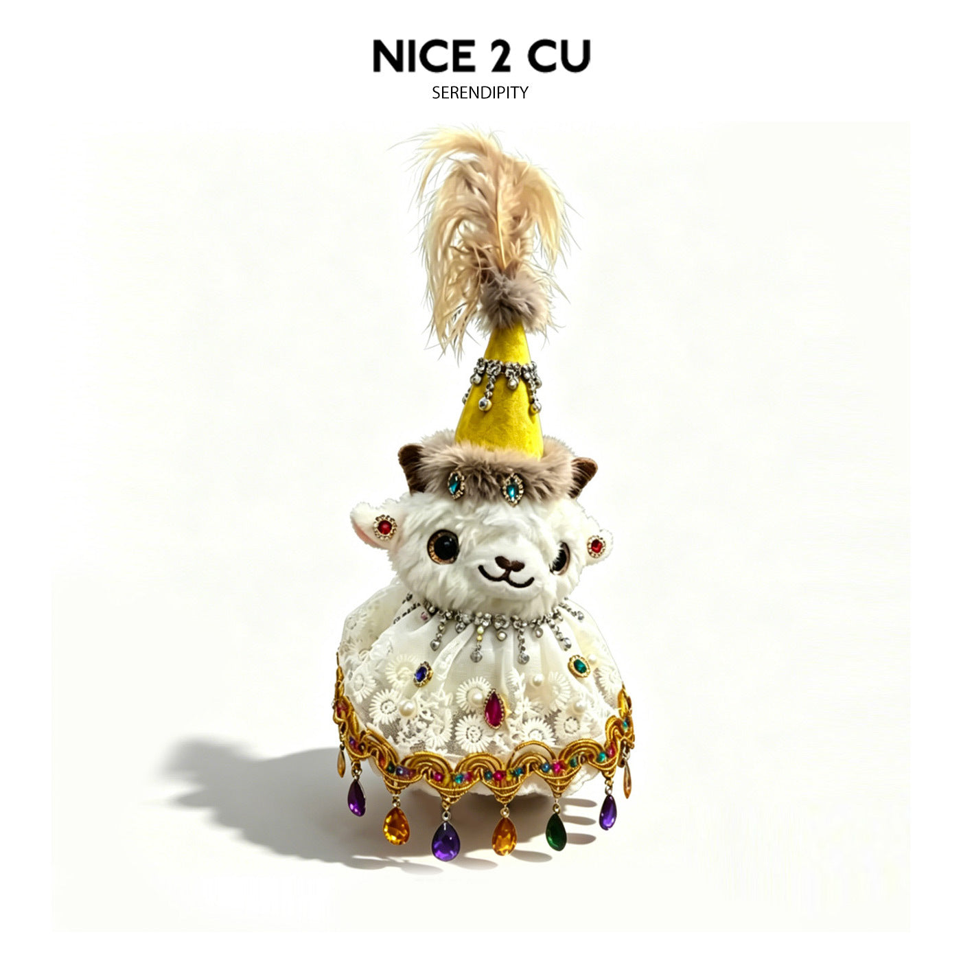 Plush lamb figurine wearing yellow tall hat and white lace dress with gold and multicolor jeweled hem