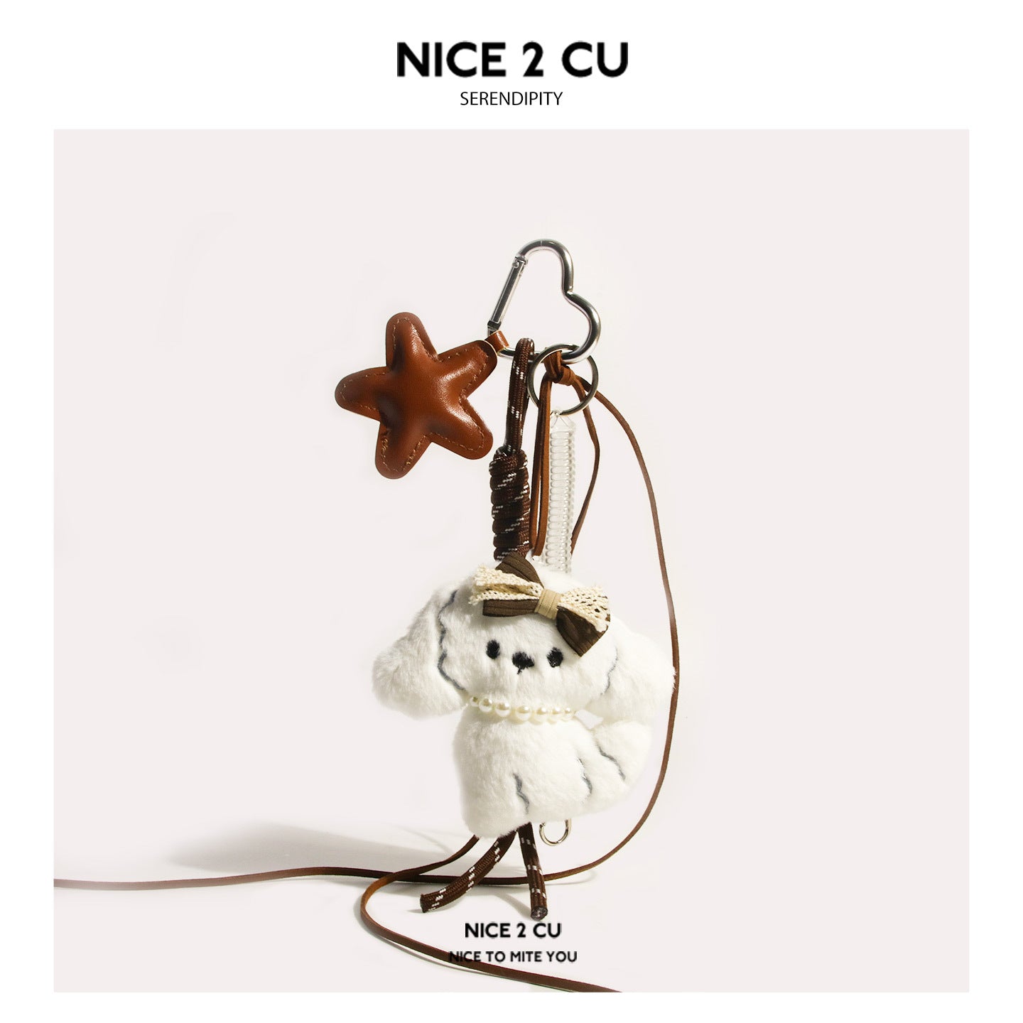 White plush dog charm with pearl necklace, brown star charm, heart carabiner clip, and brown cord