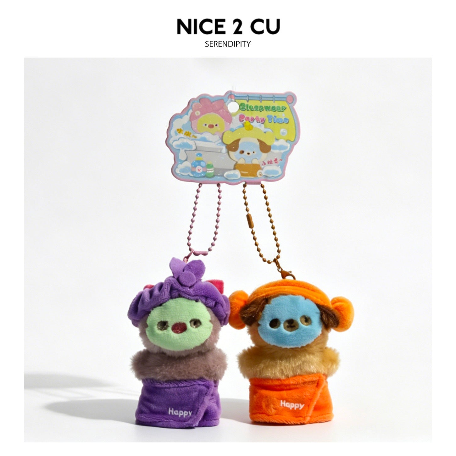 Purple pig and brown dog kawaii plush charm pair in purple and orange bath outfits on illustrated display card