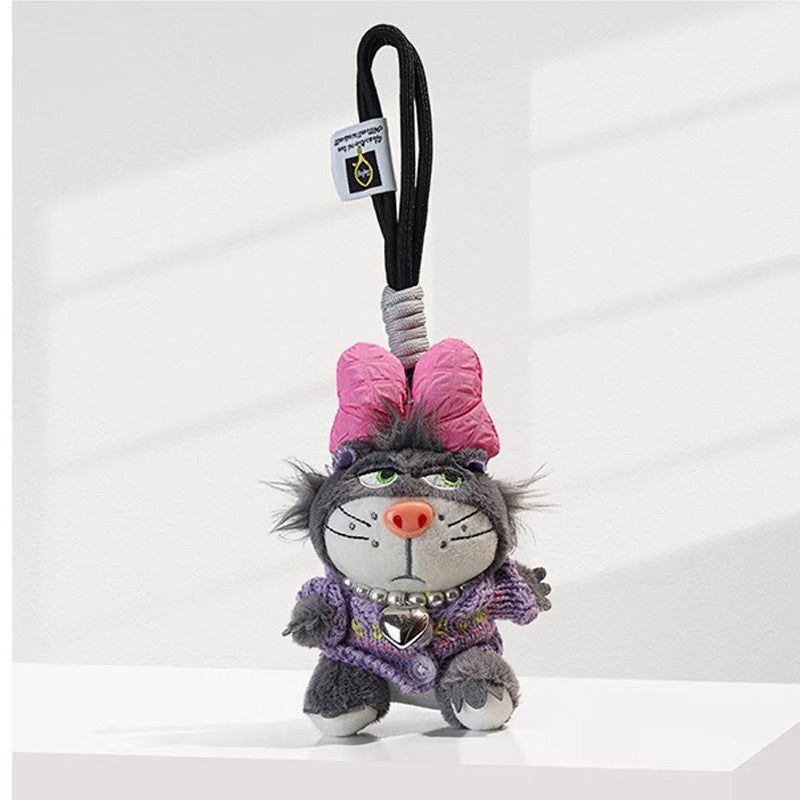 Grey cat plush charm in purple knit outfit with pink bow and silver heart pendant