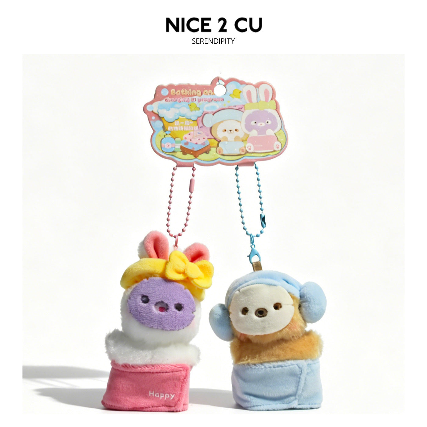White bunny and yellow bear kawaii plush charm pair with blue ear covers and pink lower garments on display card