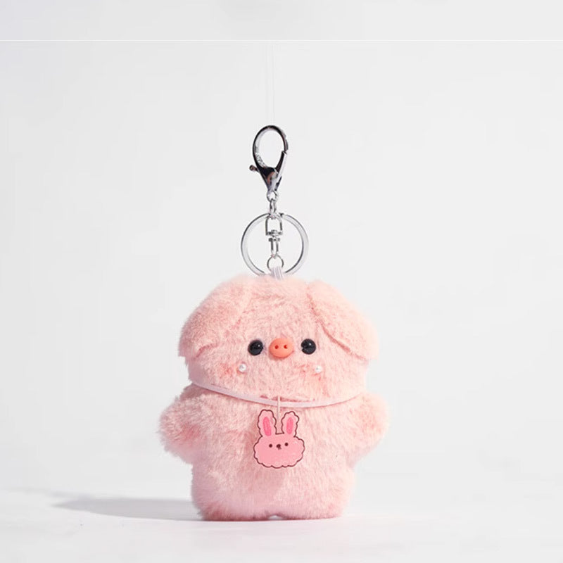 Pink plush pig keychain with small bunny-shaped pendant at chest, silver keychain hardware