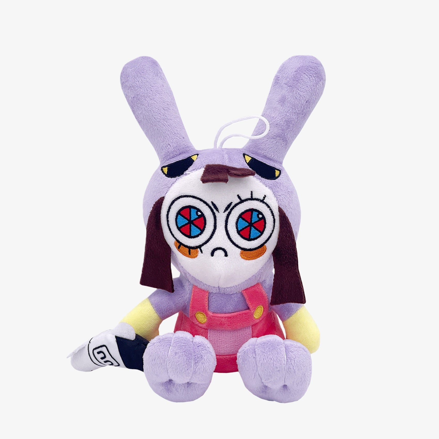 The Amazing Digital Circus Inspired Plush Toy features a purple bunny ear cartoon character with big spiral eyes and pink overalls, measuring 9.8 inches—an ideal addition to any bunny ear plush collection.
