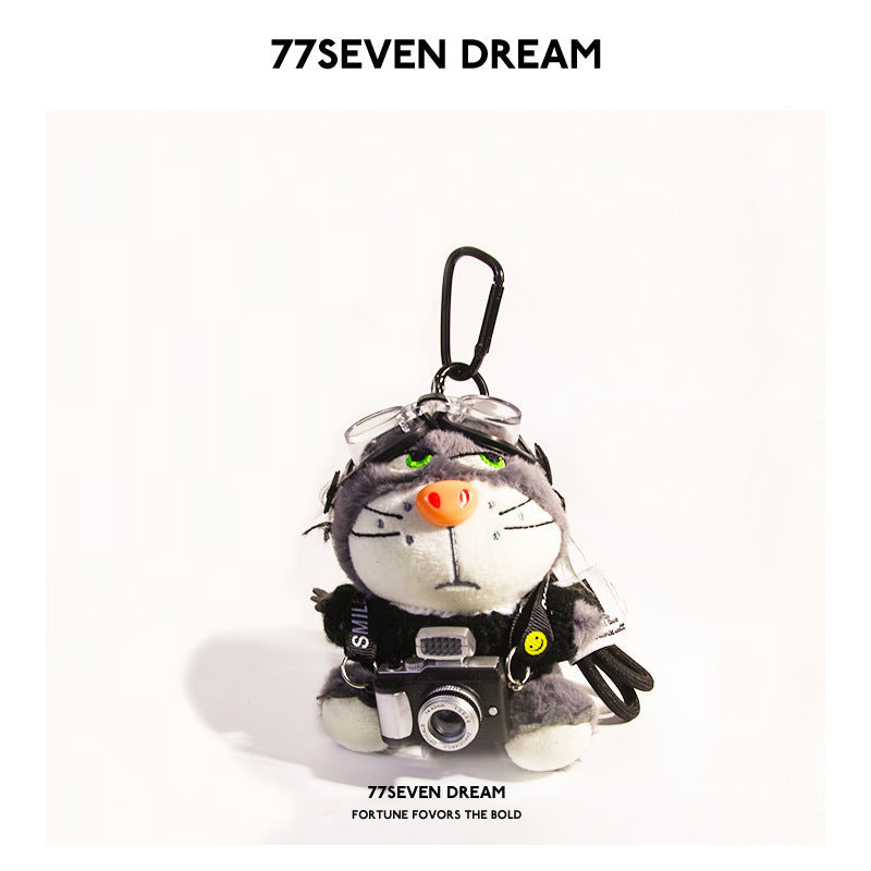 Cool plush cat keychain charm in black knitted outfit holding miniature camera with carabiner clip