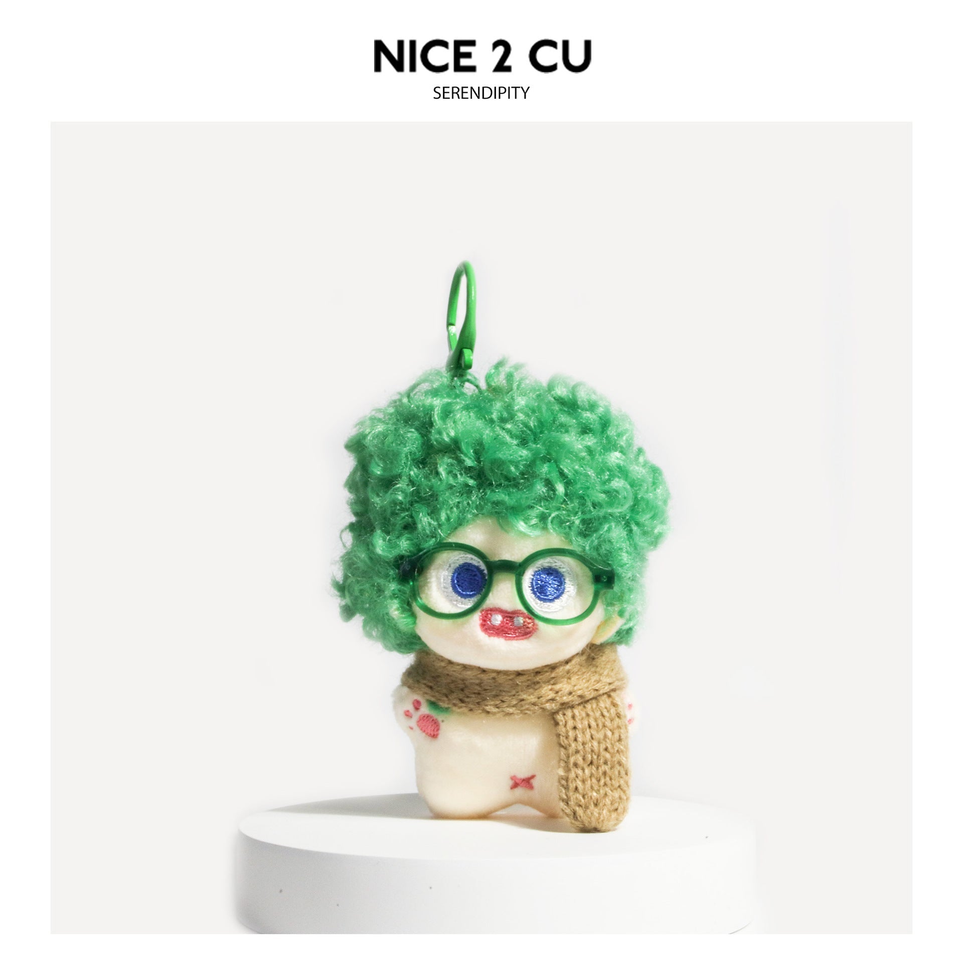 Green curly-hair plush doll bag charm with green glasses and brown knitted scarf, green hanging ring