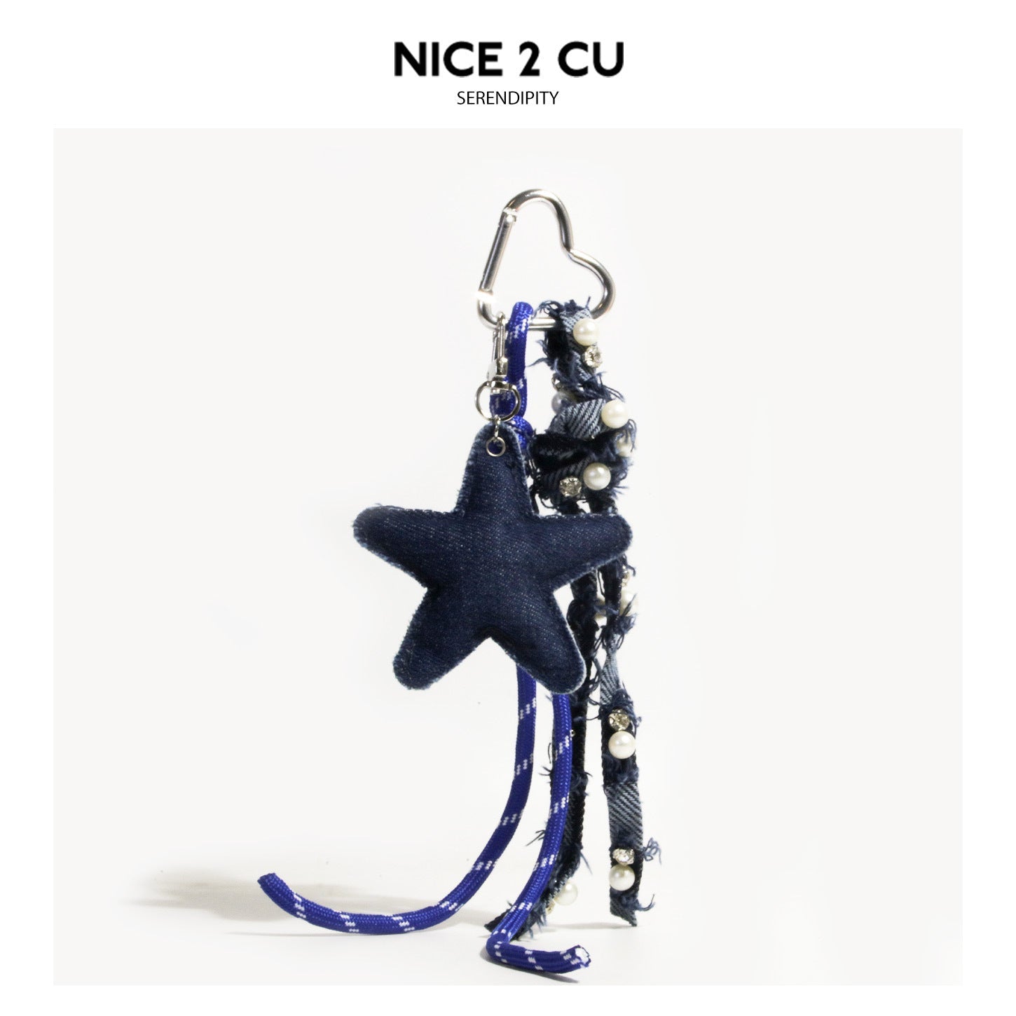 Dark navy stuffed denim star charm keychain with faux pearl tassel strap and heart carabiner