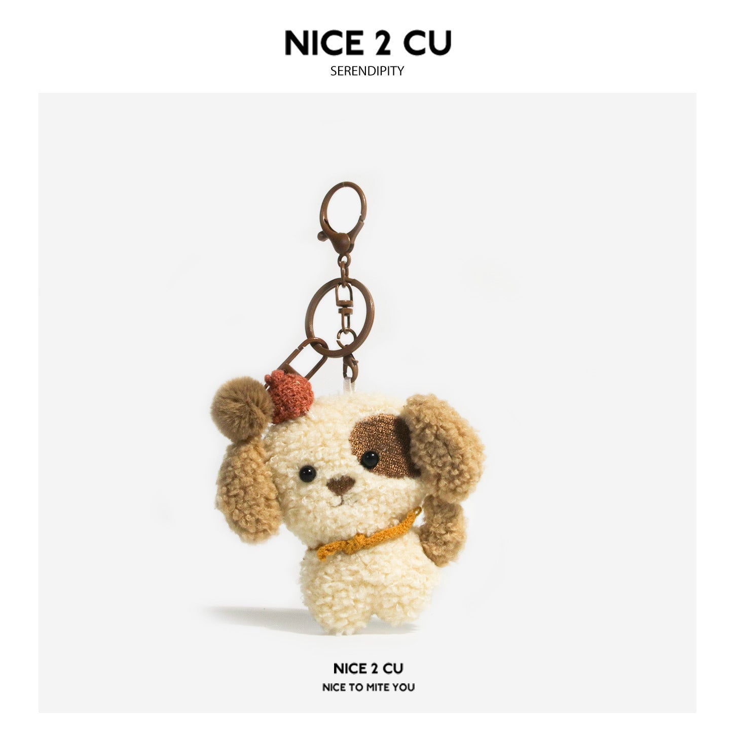 Curly cream and brown plush dog keychain charm with orange knitted scarf and hat accent