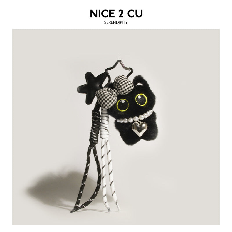 Black cat plush charm with black-and-white checkered bow, pearl-like necklace, heart pendant, and star charm