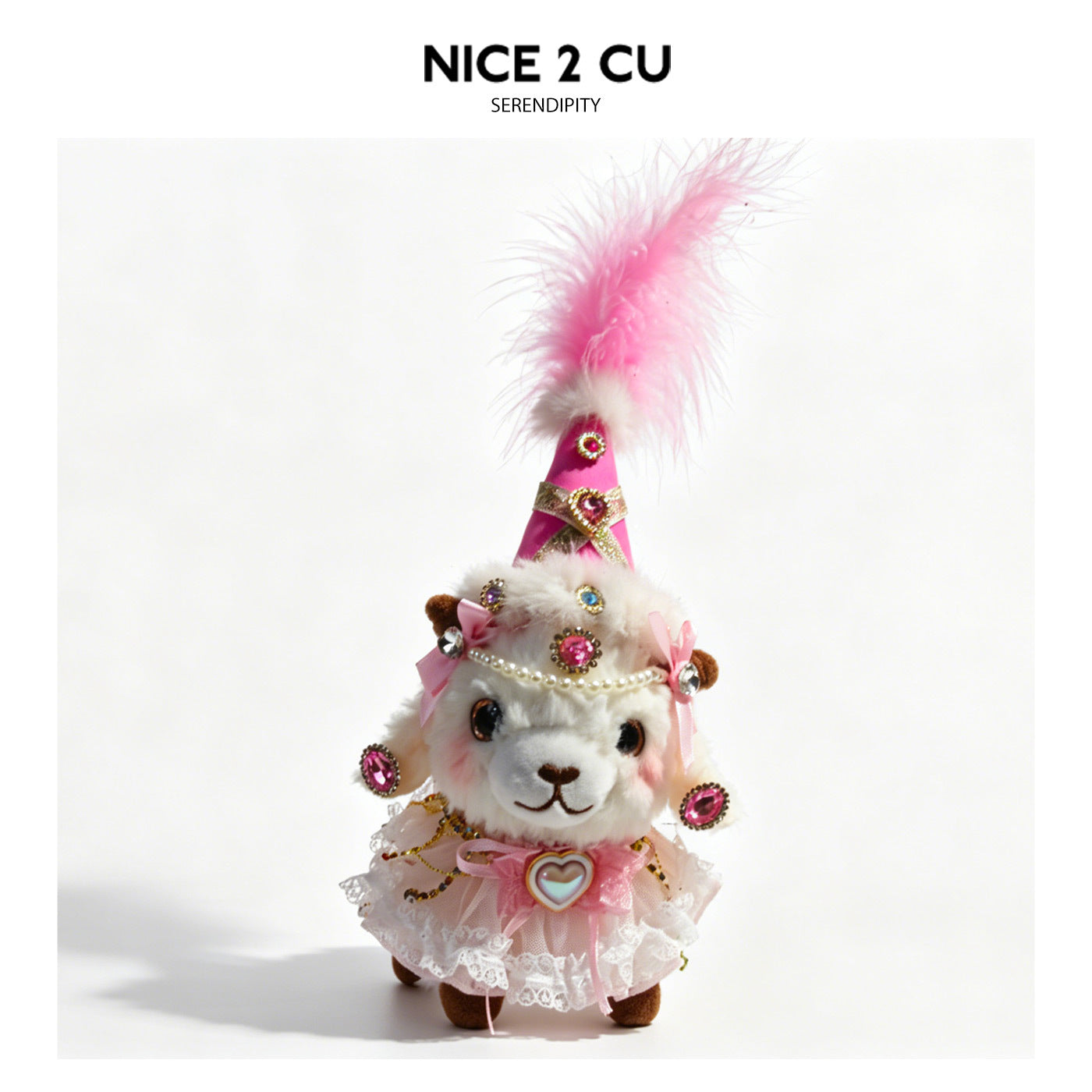 White plush lamb in pink princess costume with tall pink feather cone hat, lace layers, pearl trim, bows, and heart-shaped ch