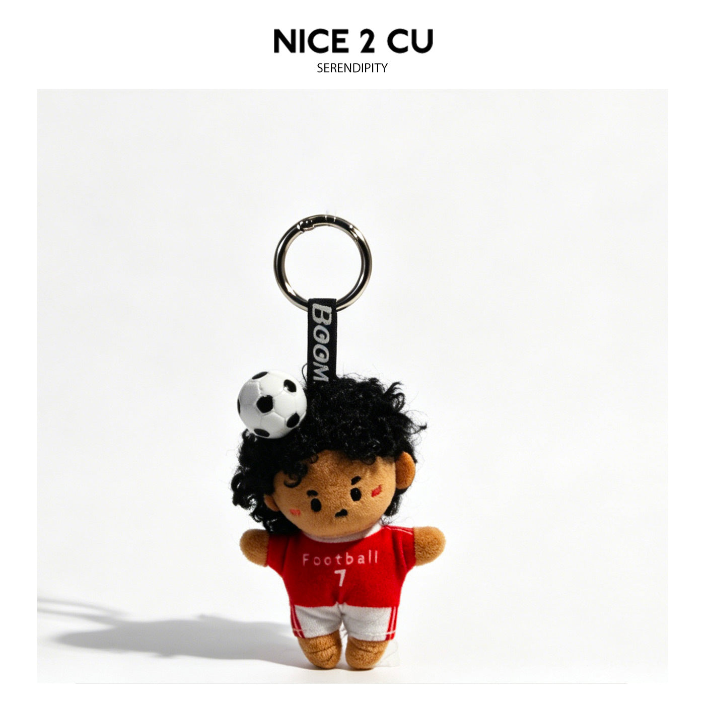 Chibi soccer player plush keychain with dark curly hair wearing red jersey and white shorts