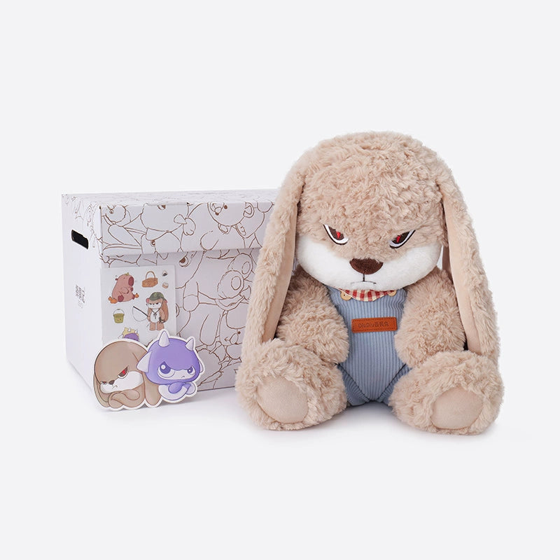 The ZEIO Bunny Plush Toy 33cm features a soft rabbit in overalls with expressive eyes, seated beside a decorated white box with animal illustrations—an adorable addition to any nursery decor.