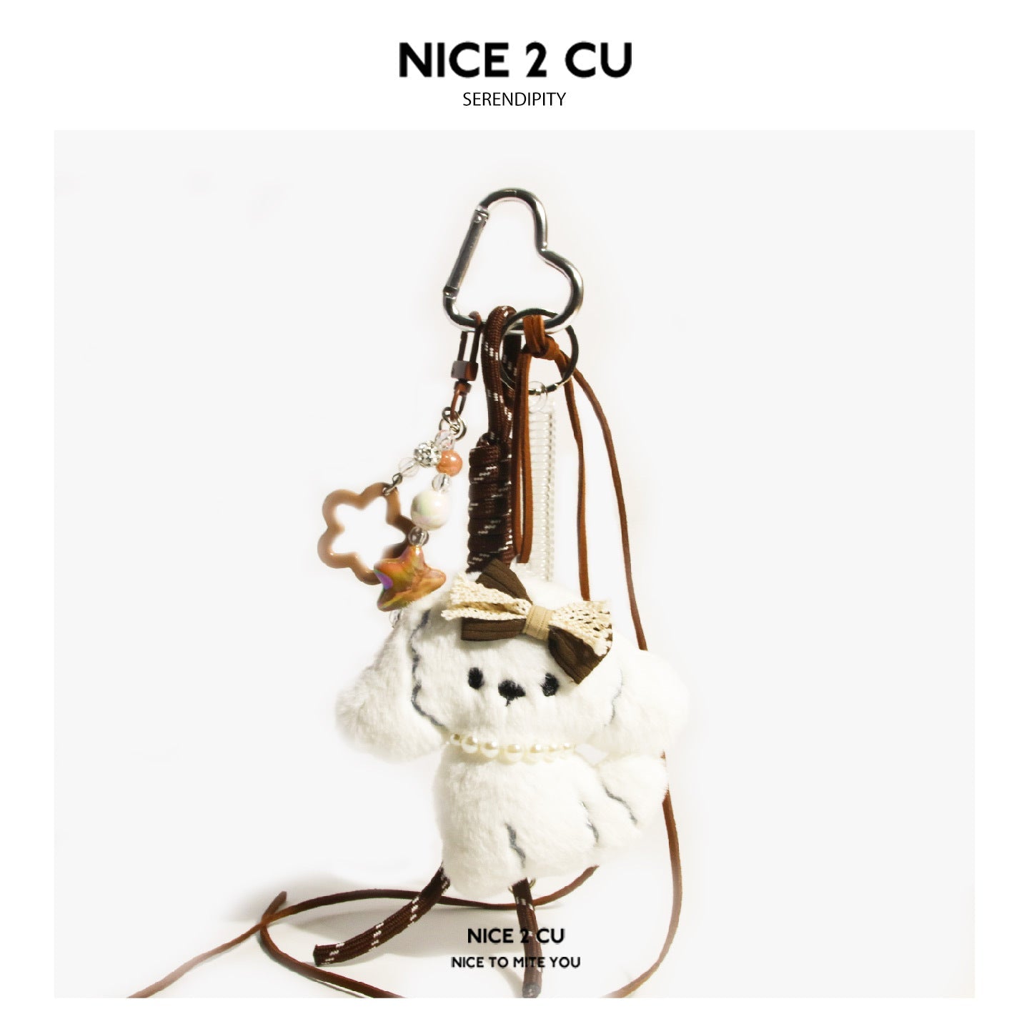 White plush dog charm with pearl necklace, colorful star cluster accent, and heart carabiner clip