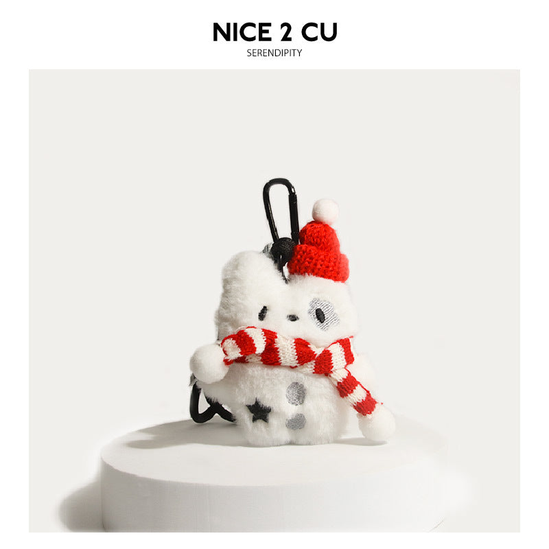 White fluffy dog plush keychain wearing a red-and-white striped knit scarf and red beanie hat with white pompom