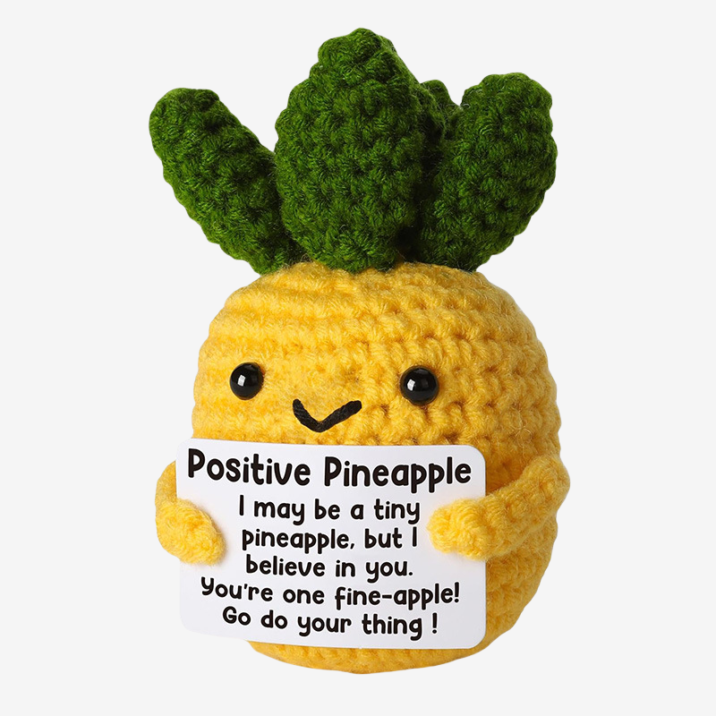 The ZoDoll Positive Pineapple Crochet Amigurumi is an adorable motivational plush holding a sign with an uplifting message—perfect for cheering you on and brightening anyone’s day!.