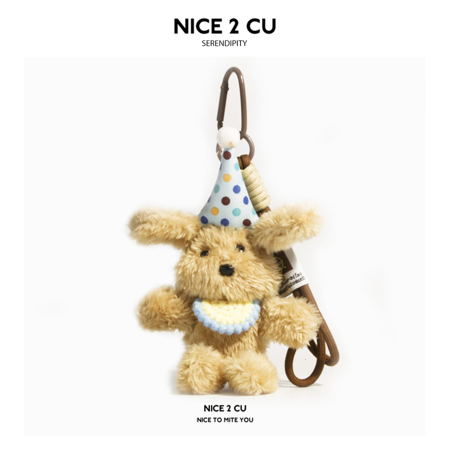 Khaki tan shaggy plush dog keychain wearing a light blue polka-dot party hat and bib with brown carabiner clip