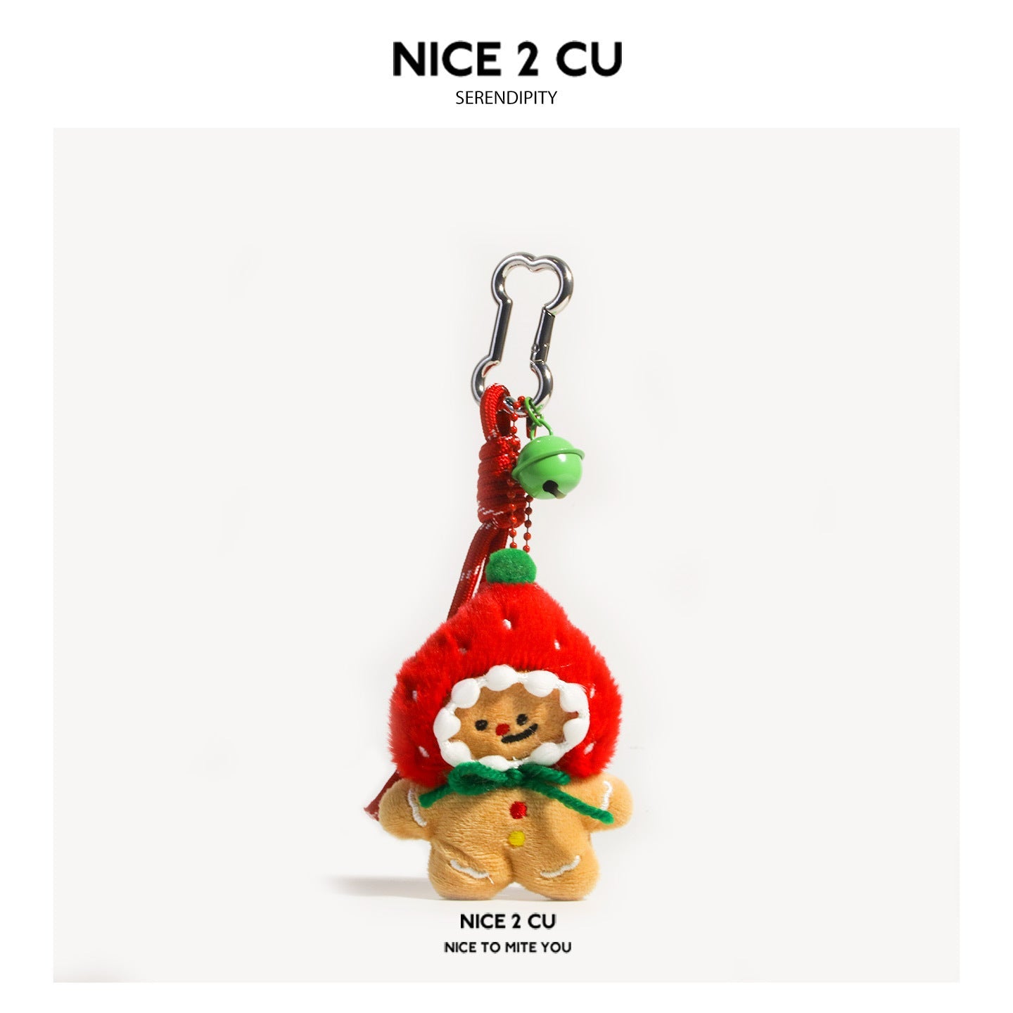 Strawberry gingerbread man plush keychain charm with red hooded headpiece and green bell accent