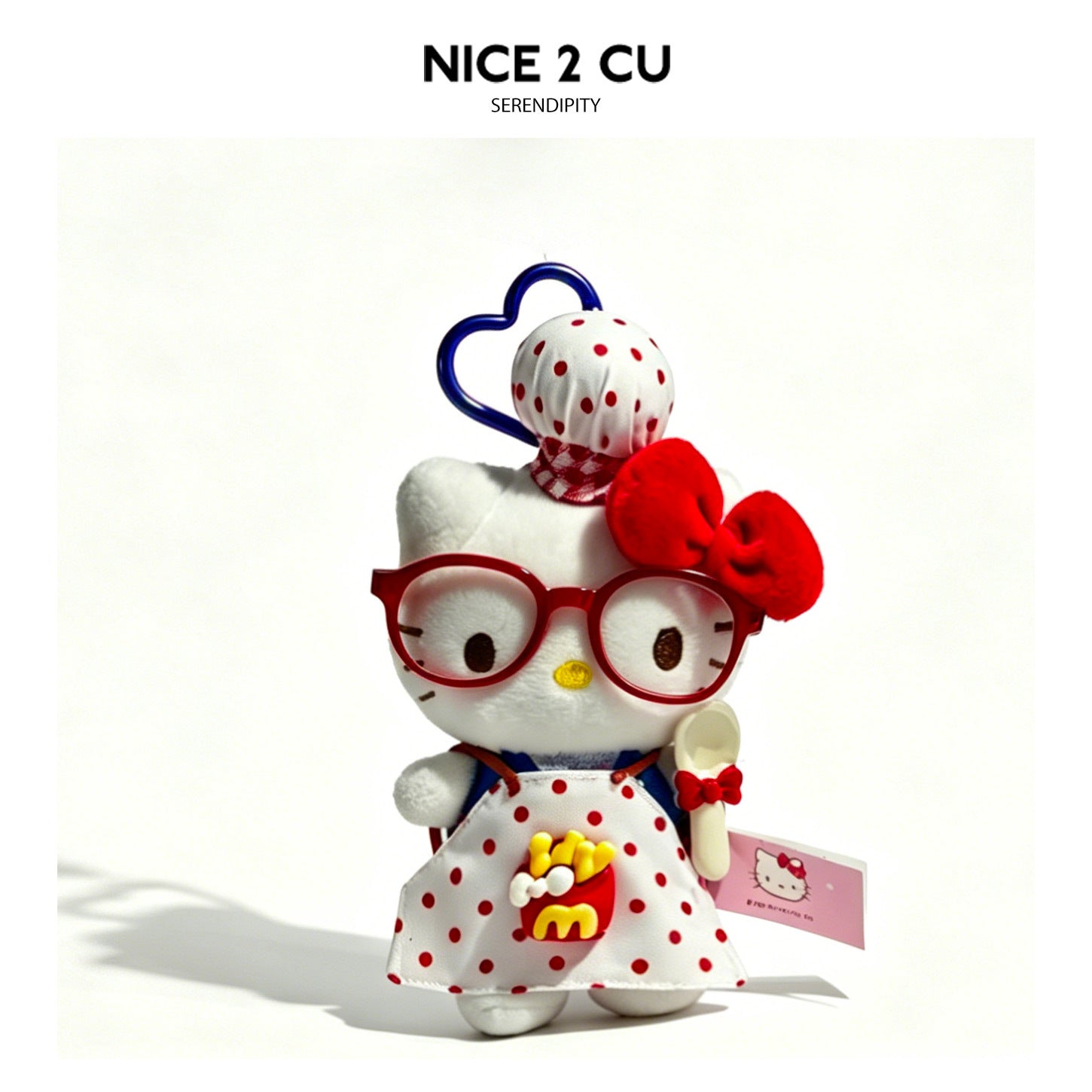 White cat plush charm in red polka-dot outfit with french-fry graphic and spoon accessory