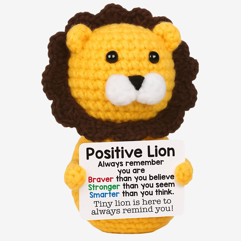 The ZoDoll Positive Lion Crochet Amigurumi is an inspirational plush toy holding a sign that encourages with, "Always remember you are braver than you believe..."—a perfect gift for motivation and joy.