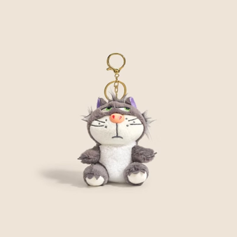 Grey and white grumpy cat plush keychain charm with purple inner ears, pink nose, and gold clip attachment