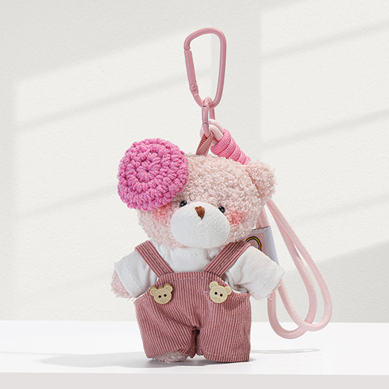Light pink plush bear charm wearing pink corduroy overalls and bright pink knitted beret, with pink carabiner clip