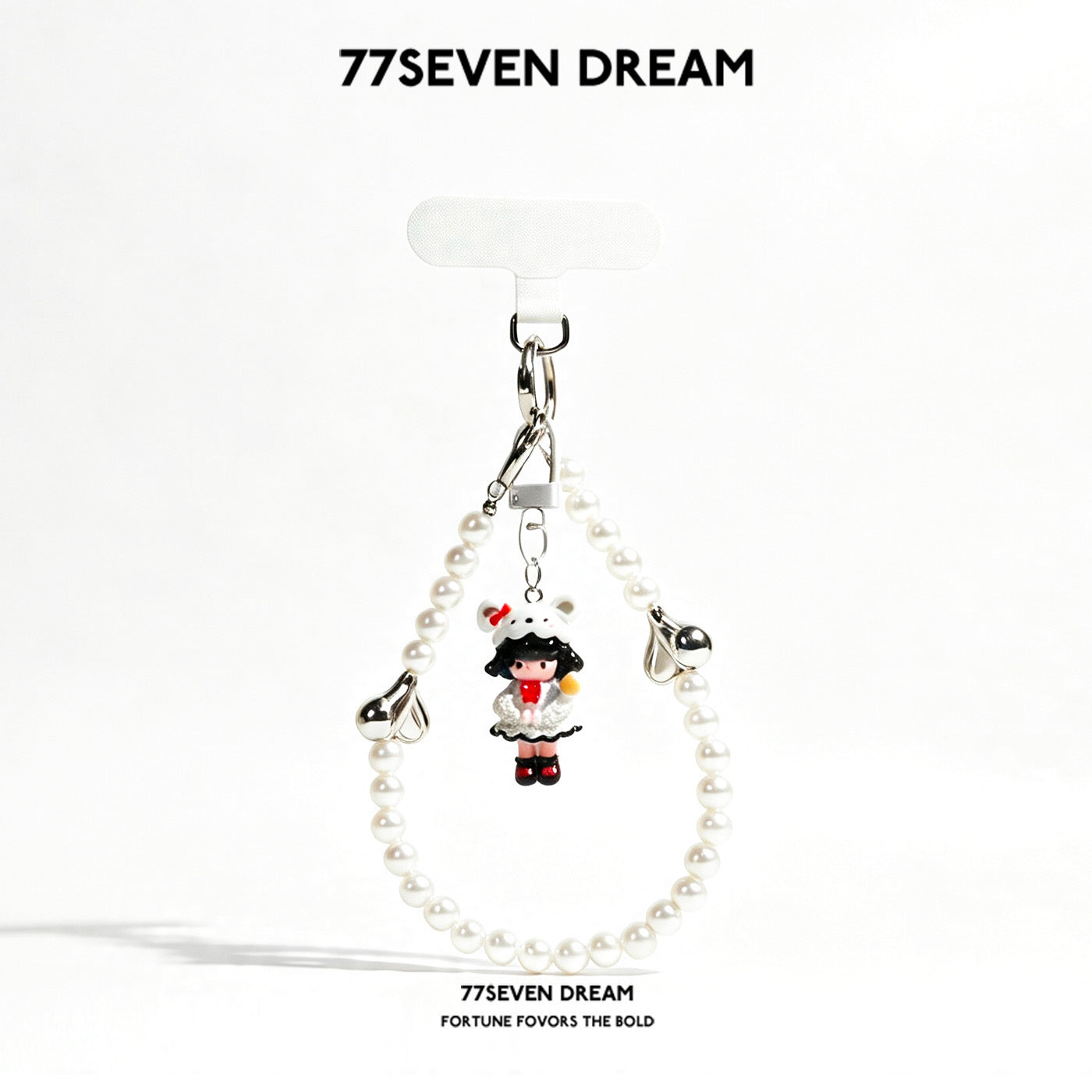 77SEVEN DREAM white pearl bead loop charm strap with girl figurine wearing a dog-hood hat and white outfit with red accents