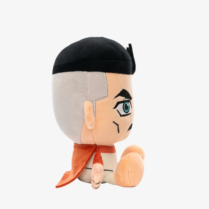 The ZoDoll Invincible Animated Series Plush Toy (18x20cm) features a soft superhero doll with light skin, black hair, gray sideburns, blue eyes, and an orange cape, sitting upright and facing right against a plain white background.