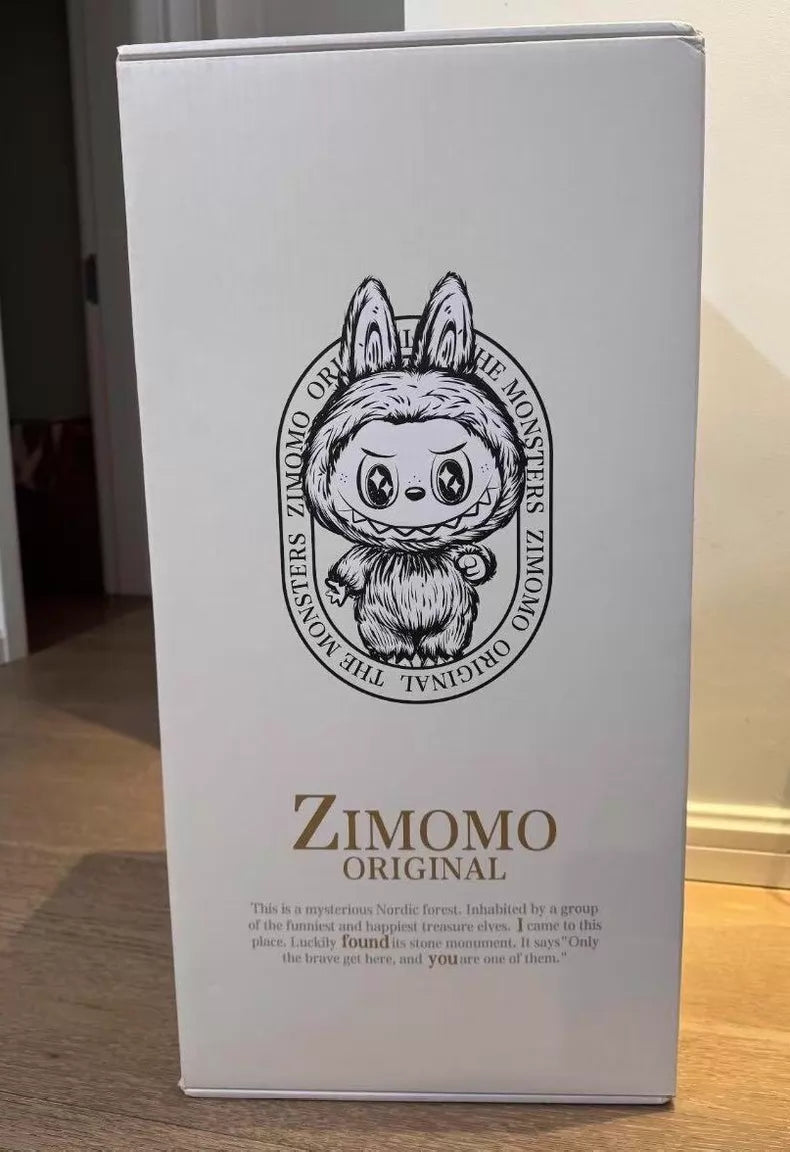 A white box with a cartoon creature, the text “Labubu Angel in Clouds 58cm Designer Plush Doll – THE MONSTERS Premium Limited Edition” by POP MART, plus a character description—ideal for collectors and Labubu fans seeking a charming exclusive.