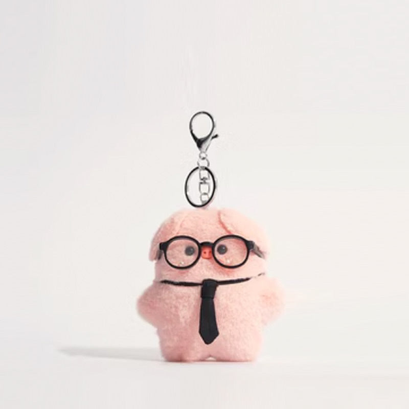 Pink plush pig keychain with round black glasses and black necktie, silver keychain hardware