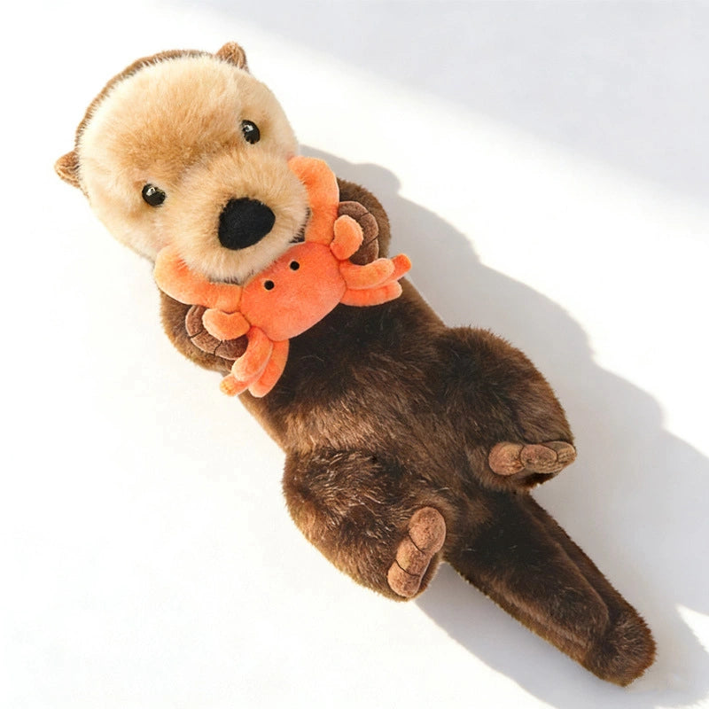 The ZoDoll Otter Plush Toy (40x12cm) features a soft sea otter lying on its back, holding a removable plush crab—a delightful stuffed animal for any collection.