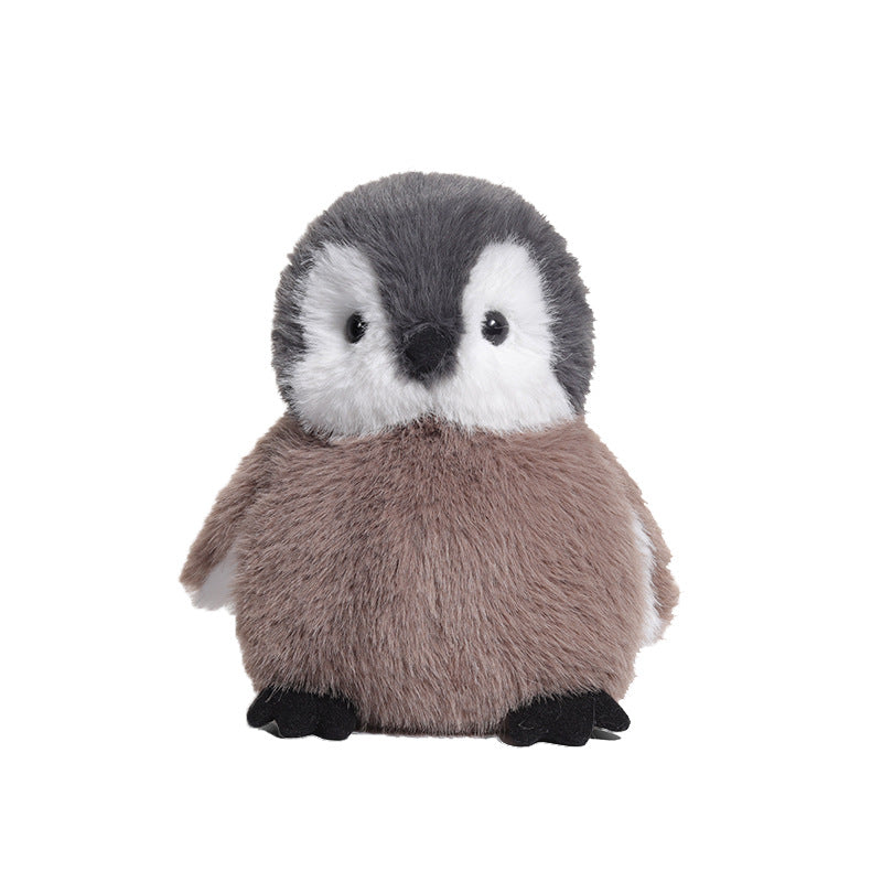 The JOOKI 20cm Baby Penguin Plush Toy features soft grey and white fur, making it an adorable stuffed animal perfect for nursery decor.