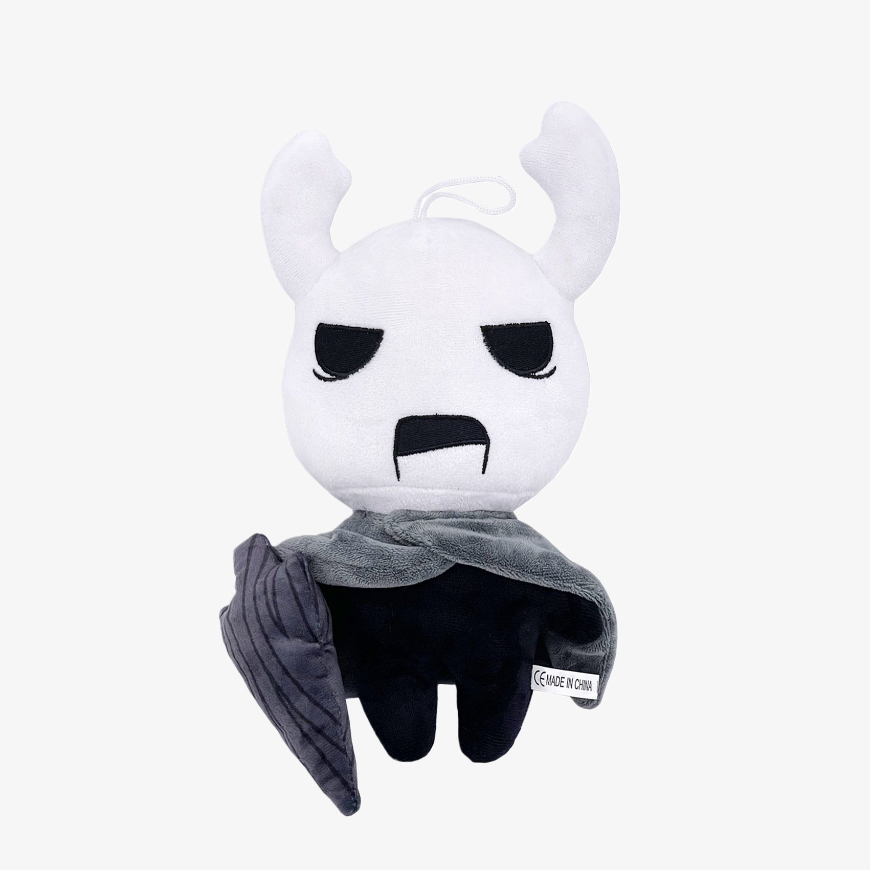 The Officially Licensed Hollow Knight Plush Doll is a 10.24-inch soft collectible featuring the iconic white-horned bug warrior with gray cloak and nail weapon—perfect merchandise for fans of the Hollow Knight series.