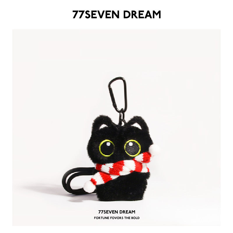 Black cat plush keychain with large yellow-outlined eyes wearing a red-and-white striped scarf