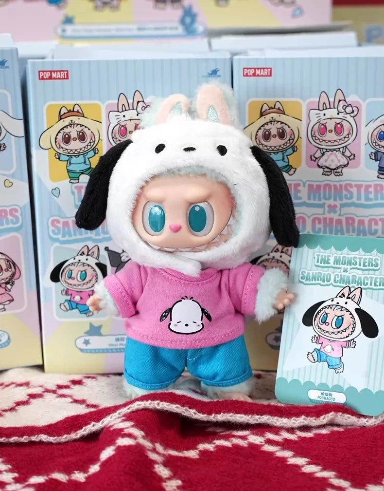 The POP MART LABUBU Hello Kitty and Friends Series Pochacco Plush Pendant Figure features adorable blue eyes, a pink shirt, blue pants, and a white hood with ears—perfect for kawaii collectors and Sanrio fans.