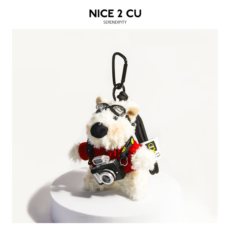 Kawaii white terrier plush bag charm in a red sweater with black goggles and a camera prop on a SMILE strap