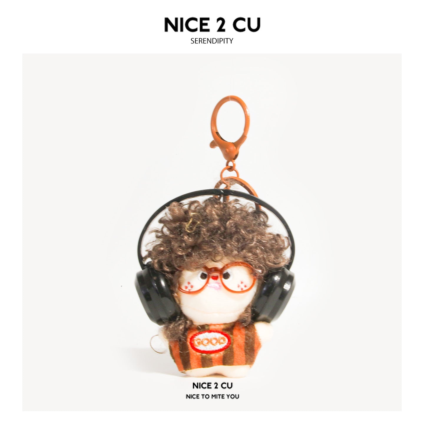 Dark brown curly-hair plush doll keychain with orange glasses, black headphones, and GOOD patch, brown-orange striped outfit