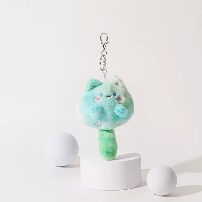 Mint-green kawaii plush cat charm with white face, pink cheeks, and silver metal lobster clasp