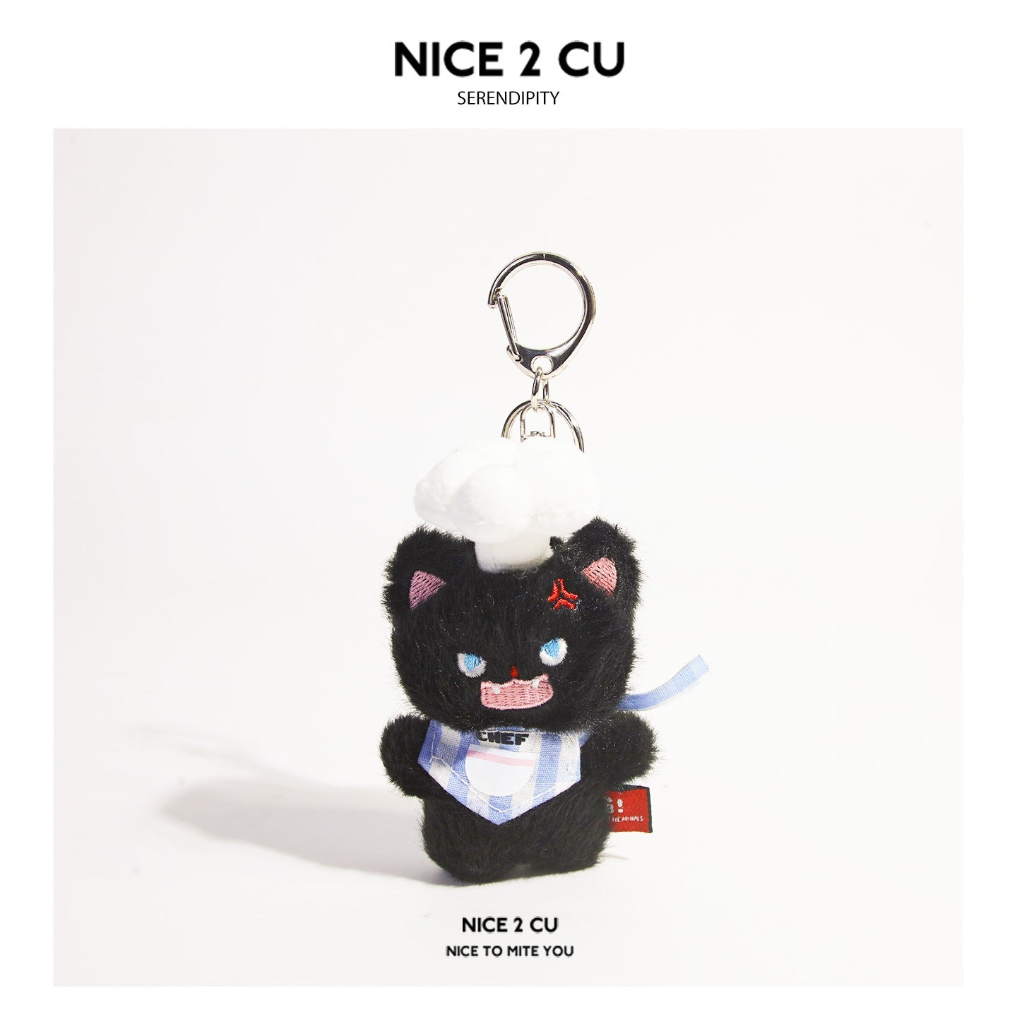 Black fluffy cat plush keychain wearing white chef hat and blue checkered outfit with silver clasp