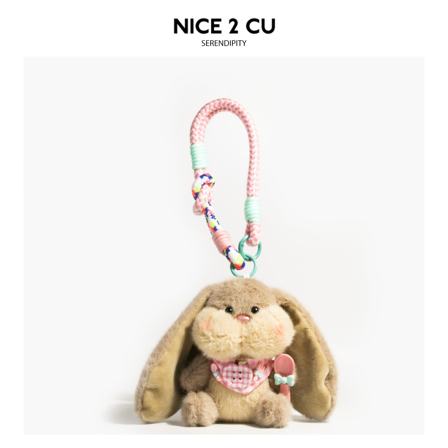 Light brown floppy-ear bunny plush charm with yellow-cream face, pink gingham bib, and braided cord clip