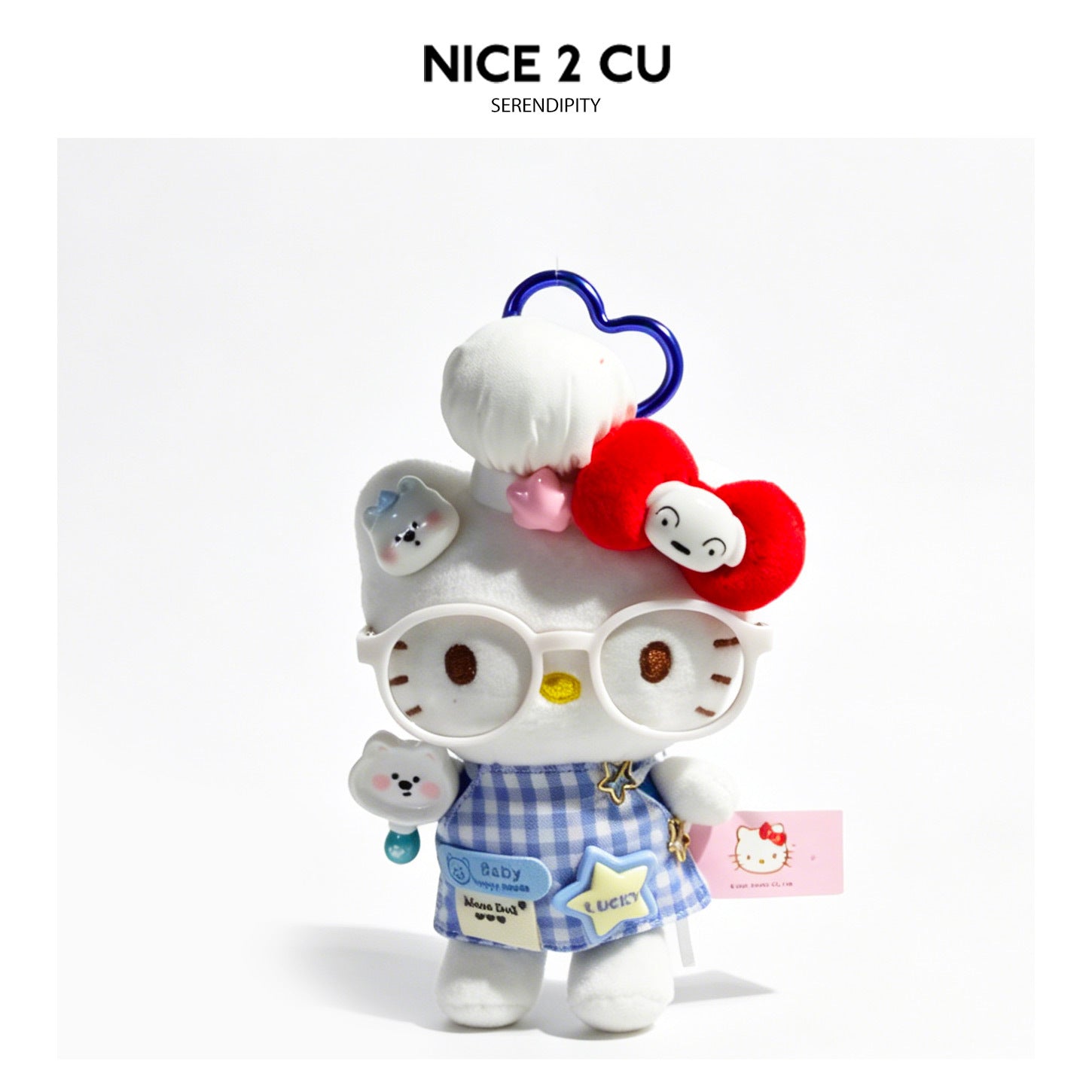 Kawaii white cat plush bag charm wearing chef hat, gingham apron, and oversized glasses with blue heart carabiner clip
