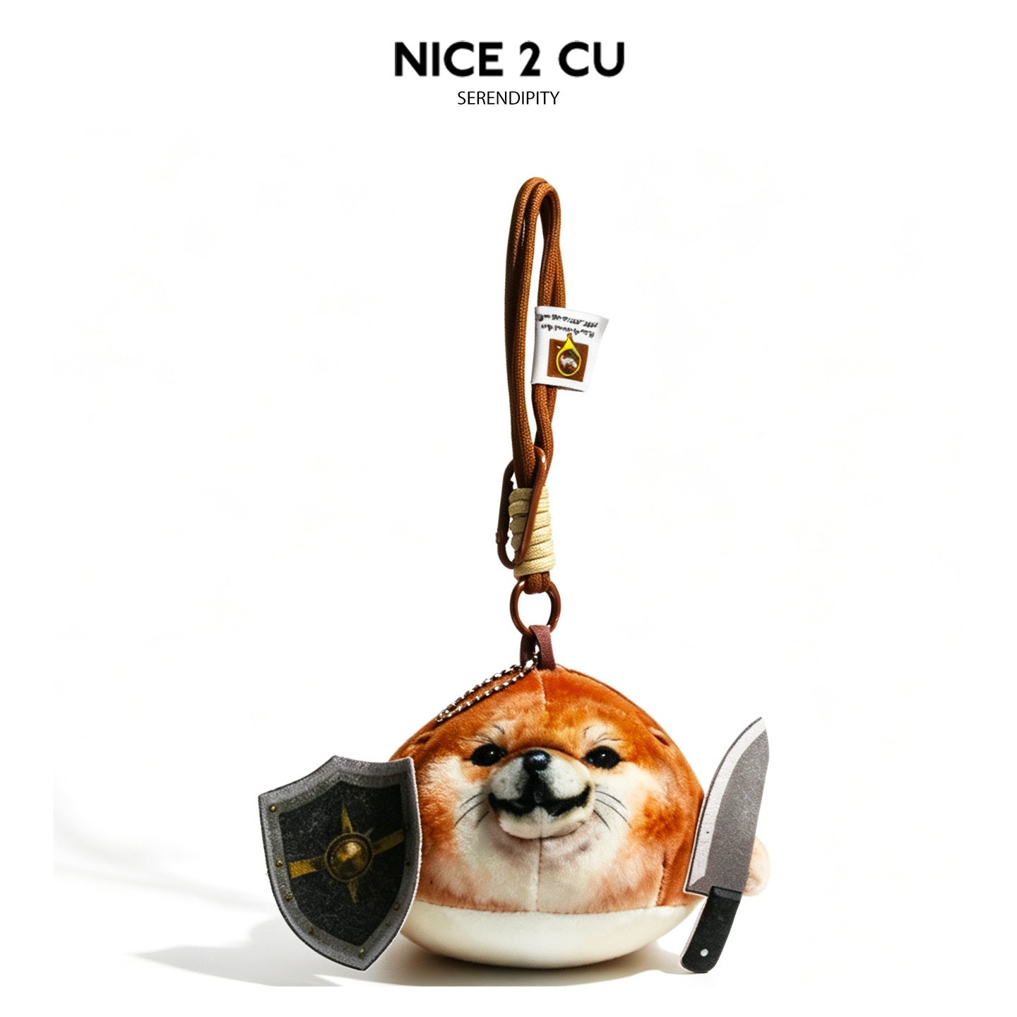 Round Shiba Inu plush bag charm in orange-brown and cream with miniature grey shield and knife props on braided rope strap