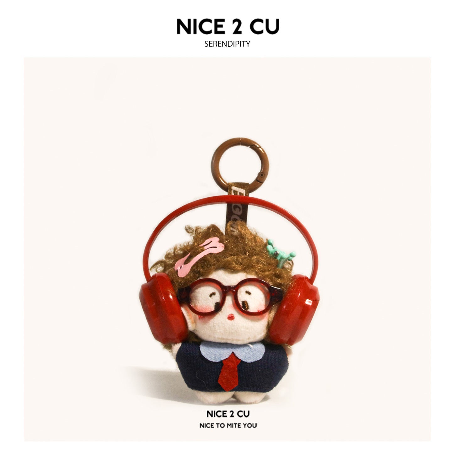 Chibi plush charm with brown curly hair, red round glasses, and red over-ear headphones